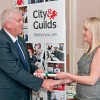 Rob McMeekin receiving Diploma from Laura Harrap - City And Guilds